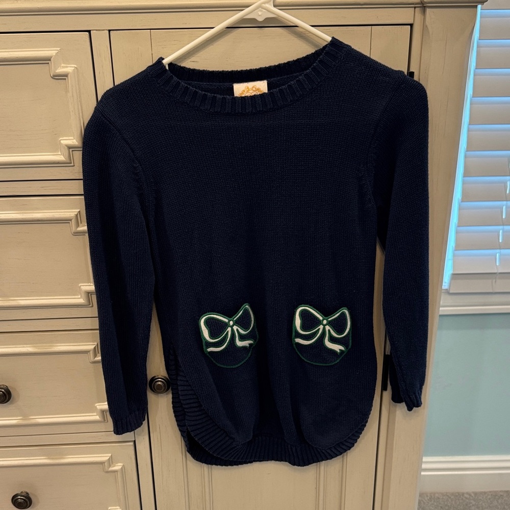 The Beaufort Bonnet Company Navy Sweater with Green Bow Accents